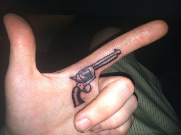 Stunning Gun Tattoo On Finger