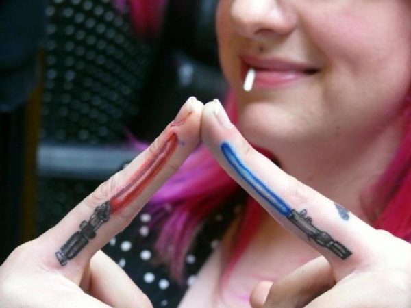 Stylish Sword Tattoo On Fingers