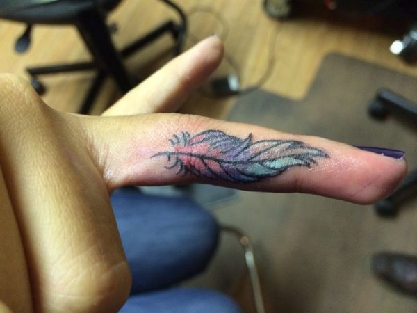 Sweet Colored Feather Tattoo On Finger