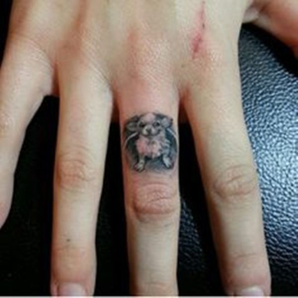 Sweet Dog Tattoo On Middle Finger